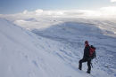 09-9743 Hill Walker on the Approach to the Summit of Cross Fell in Winter with the View Towards Great Dun Fell and Beyond. North Pennines